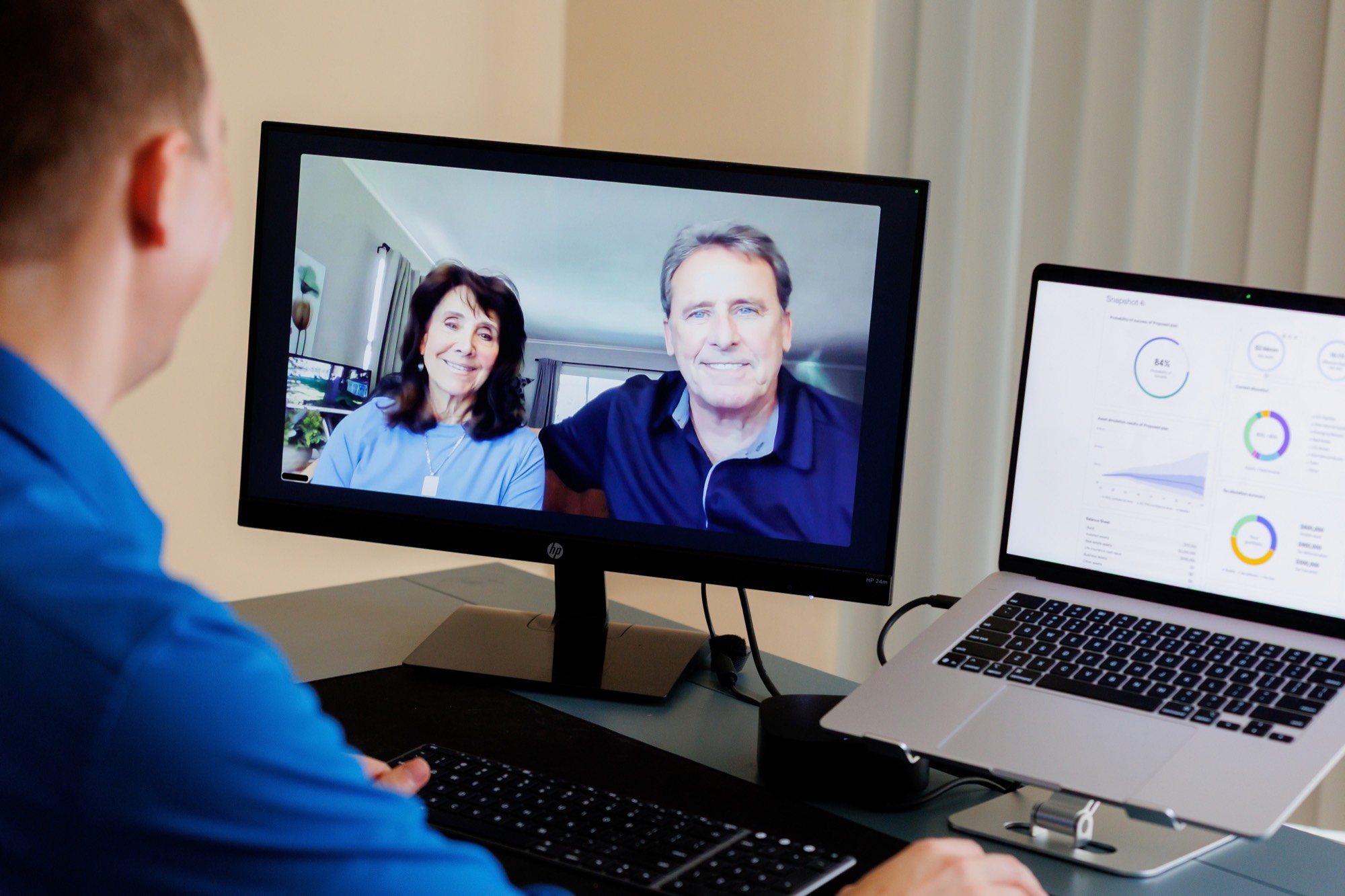Jordan meeting with a couple by video call, a planning dashboard open beside him