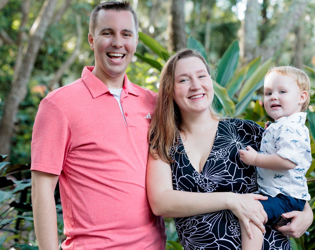 Jordan with his wife and son in a garden